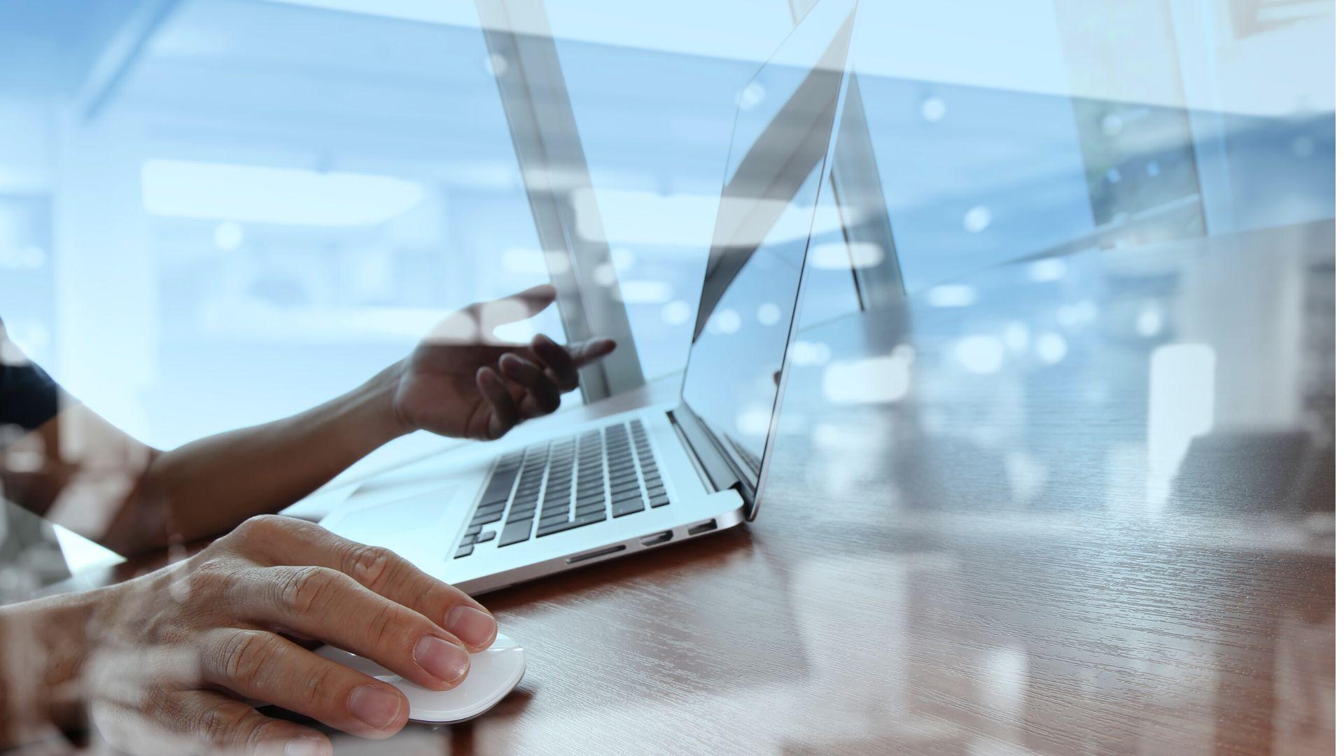 Image of hands using a laptop