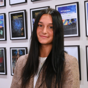 Portrait photo of a woman with light skin and dark hair.