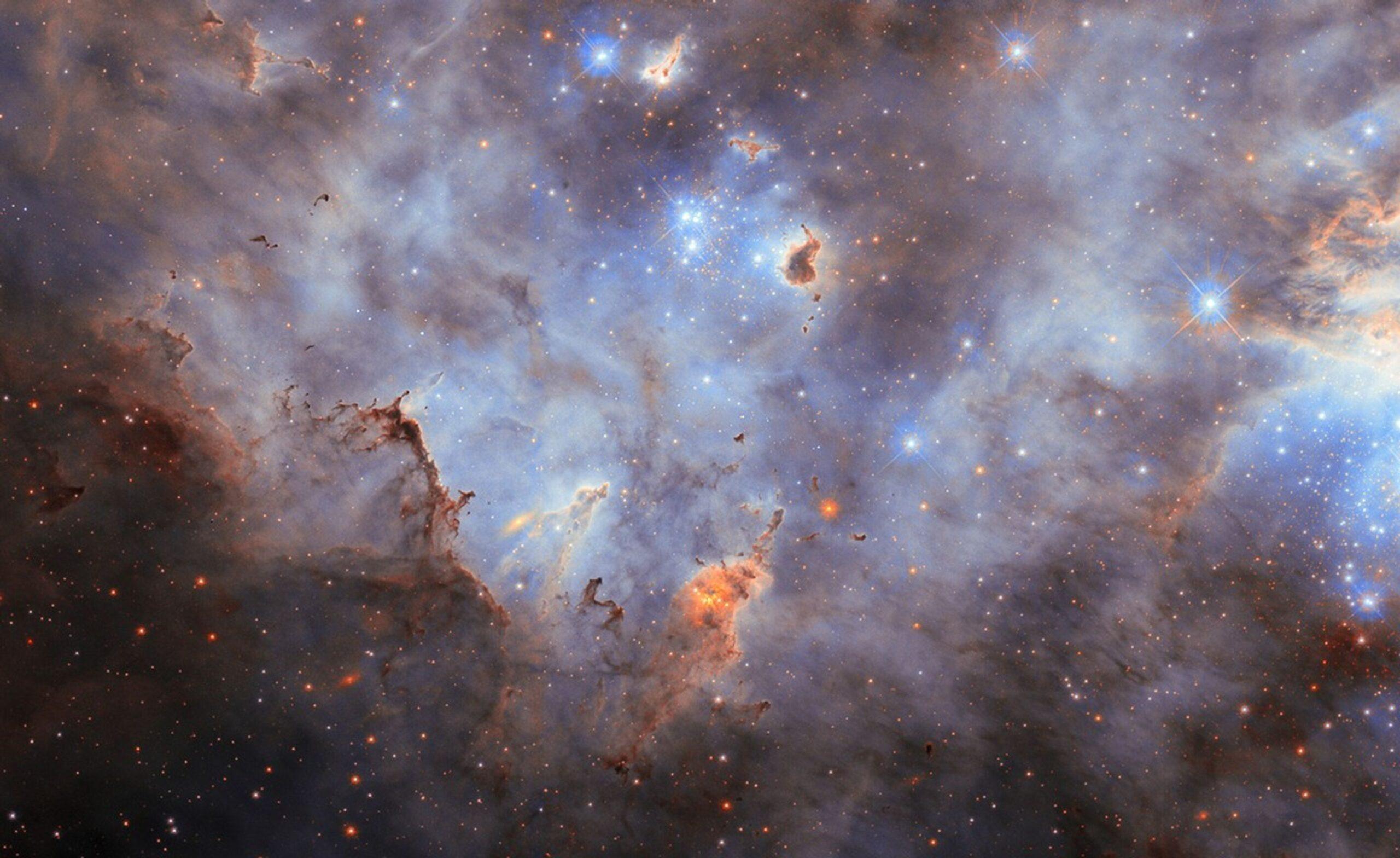 The nebula LMC N44C, showing a cloudy starscape from an impressive star cluster in the Large Magellanic Cloud.